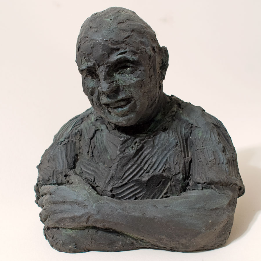 Sculpture of man's head and torso with arms folded